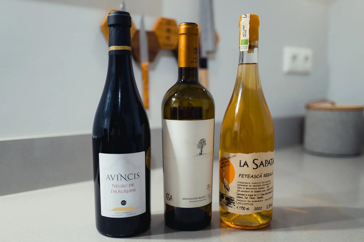 Three Romanian wines from MICU lined up: Avincis red, ISSA white and La Sapata orange