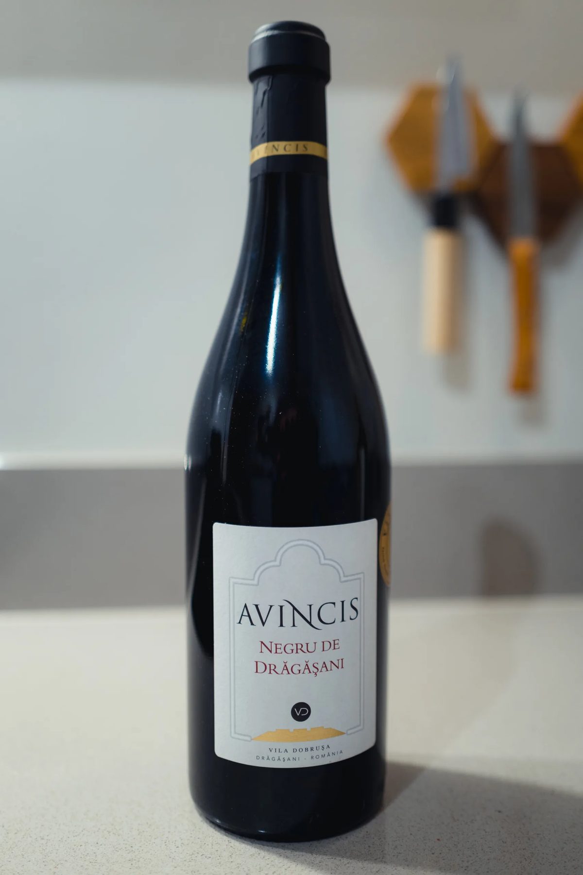 Avincis Negru de Dragasani red wine bottle standing on a kitchen counter