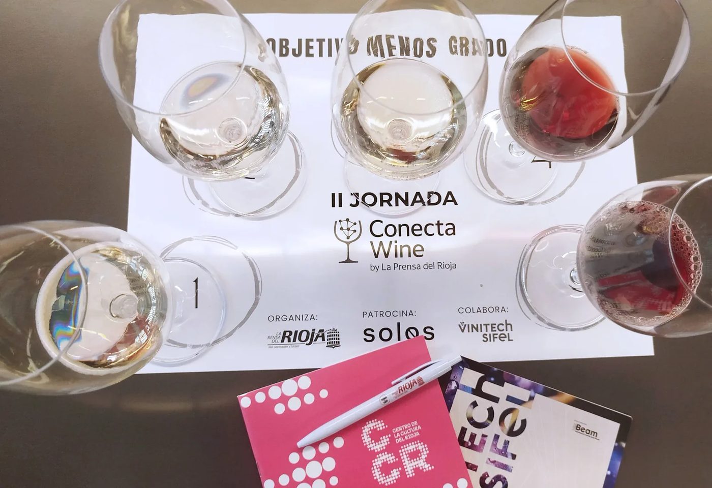 Five glasses of alcohol-free wine on a tasting table at the NoLo congress in Logroño, Rioja.