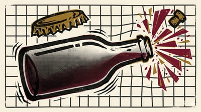 Hazy pét-nat bottle with crown cap and hand-drawn label on wooden table