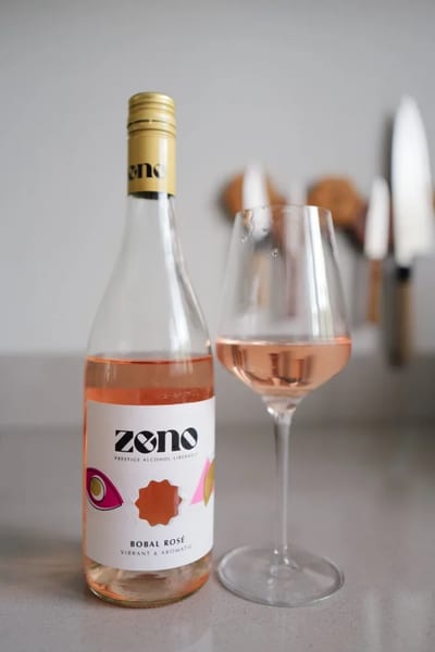 Bottle of Zeno Bobal Rosé alcohol-free rosé beside a glass